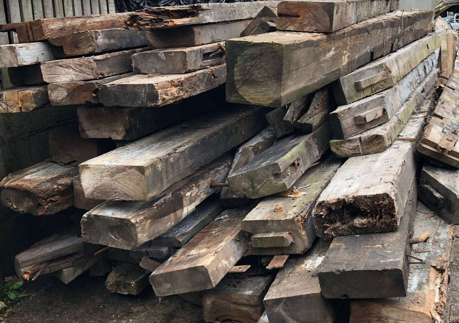 Reclaimed pitch pine beams ready to process into floorboards